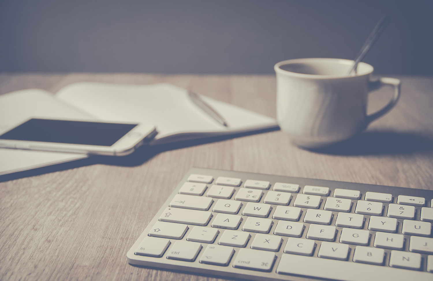 magic-keyboard-beside-coffee-mug-on-desk-796601